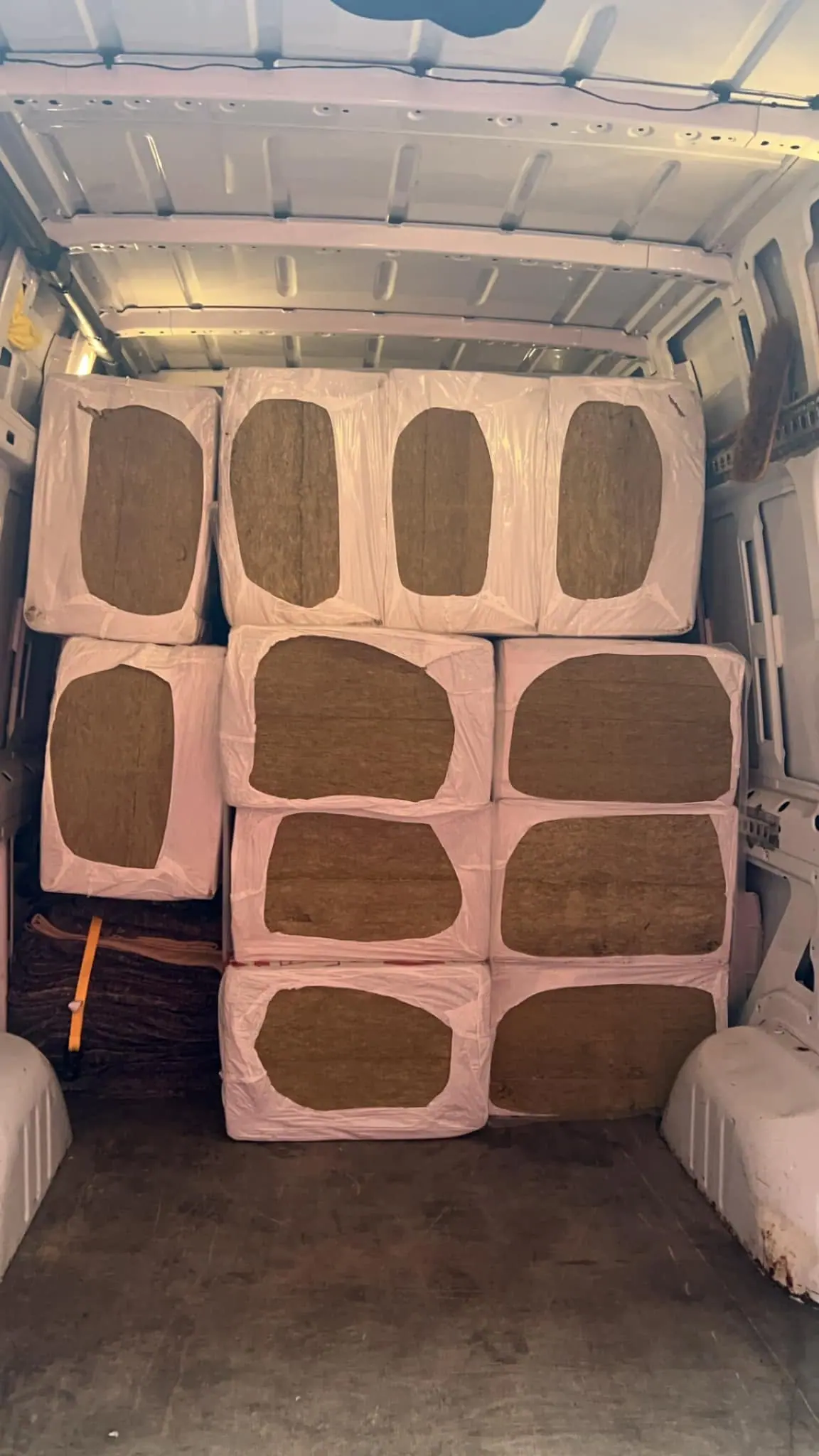 Wrapped pallets of commercial goods stacked in an Optima Transport van for Sheffield to Birmingham haulage