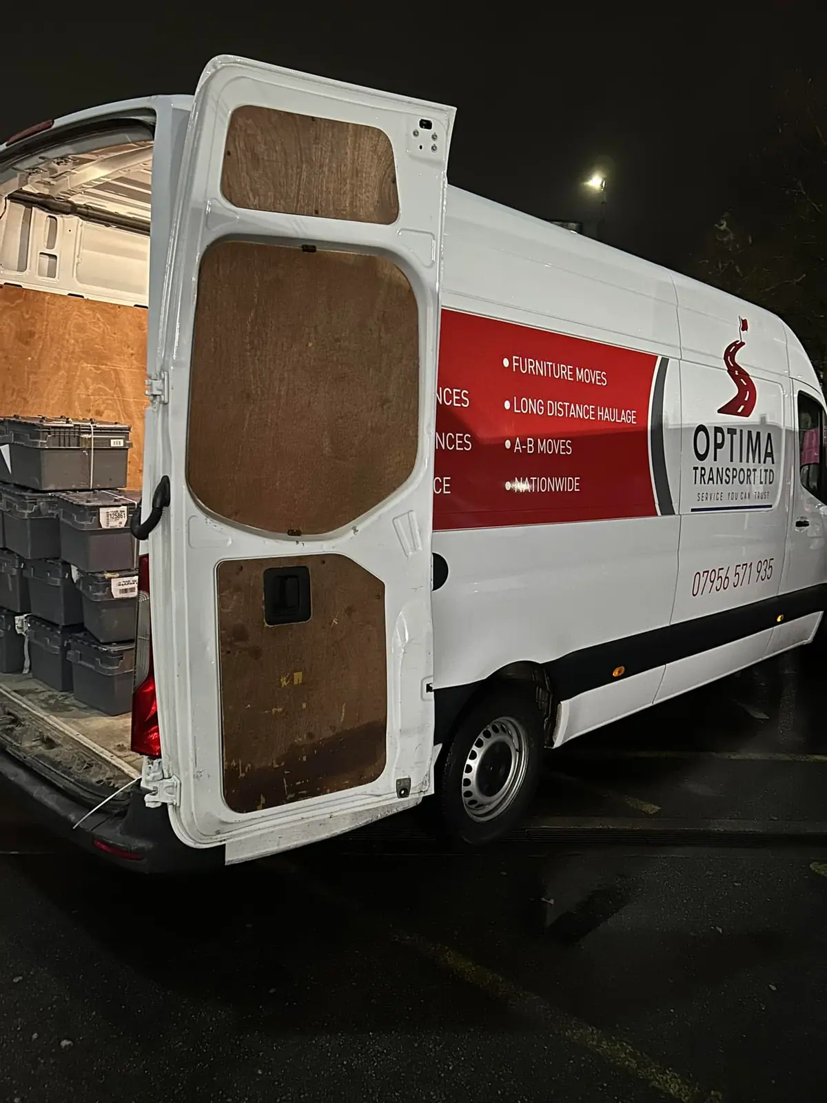 Optima Transport van with rear doors open during an evening end-of-lease clearance