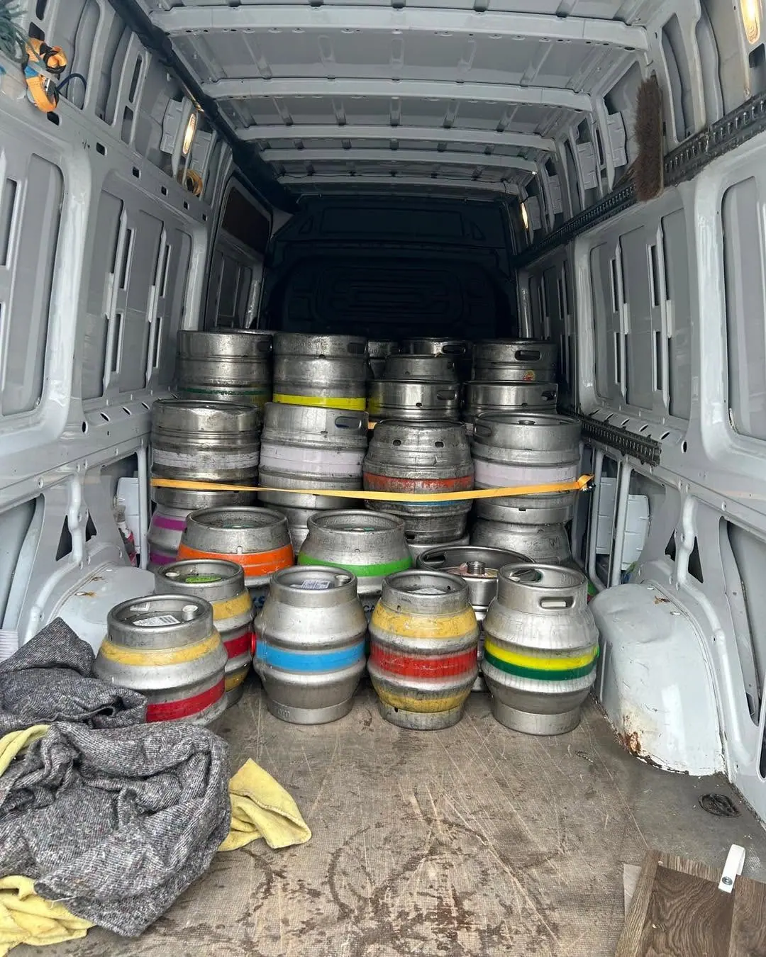 Metal casks secured in an Optima Transport van during an industrial unit clearance