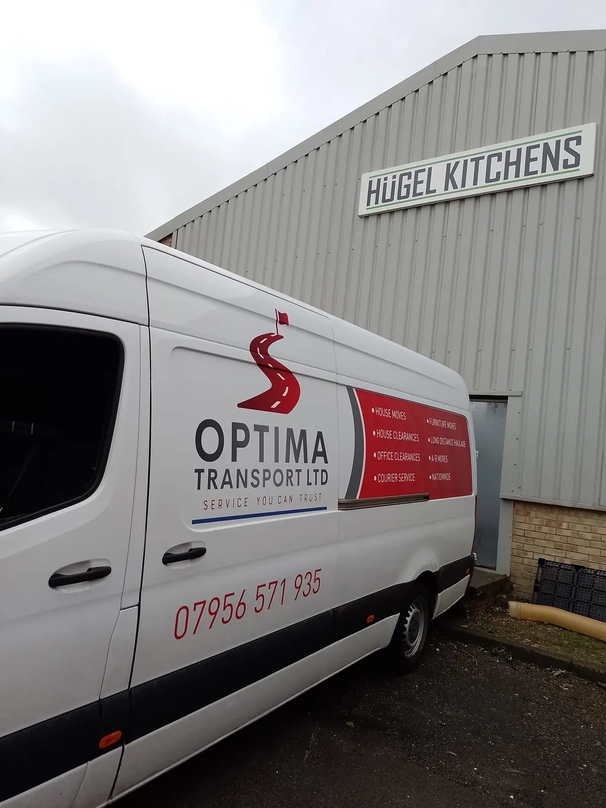 Optima Transport van outside a trade unit used for retail and shop clearances
